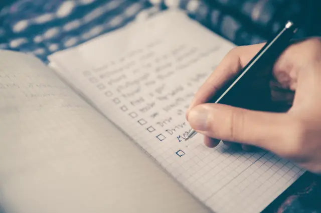 Learner checking off a handwritten study plan
