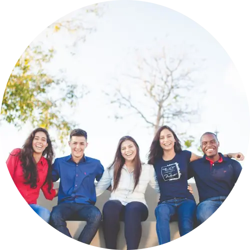 A diverse group of young adult students smiling together